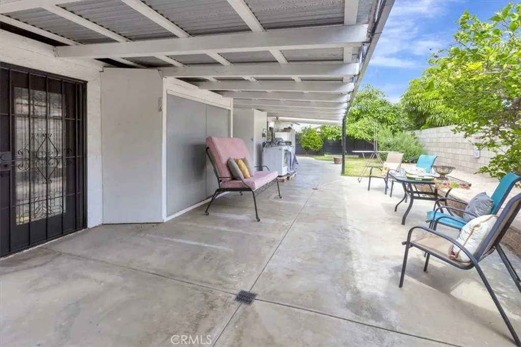 Rear veranda and storage. Two private door access points to interior downstairs primary en suite also used as private guest quarters.