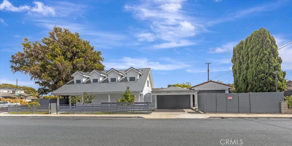 CUSTOM BUILT IN 2020 - AUSTRALIAN INDUSTRIAL FARMHOUSE on spacious corner lot with front and wrap-around yards and access to out buildings for multi-uses.