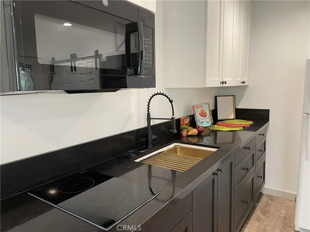 GALLERY: Downstairs primary en suite with food preparation area.