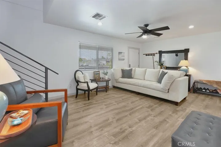 Up the custom industrial stairs to Primary Suite with fireplace and balcony, Media Loft, and optional 4th bedroom used as an office.