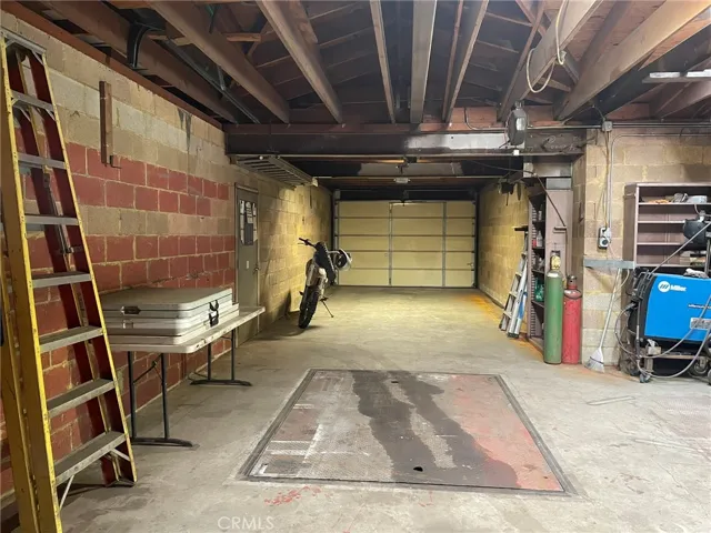 L-shaped from front garage door entry and note side yard door for storage and sturdy privacy and sound dampening between neighbors.