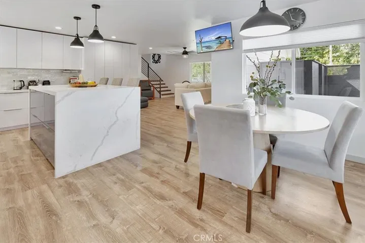Island with custom storage drawers and hidden utensil drawers inside. Full bank of customized pantry and cabinets with lazy-susan corner and pull out shelves, deep drawers providing plenty of storage.