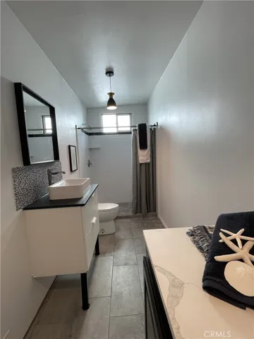 GALLERY - GARAGE MULTI-USE FLEX SPACE includes a three-quarter bath with full-sized laundry and utility sink. (Past picture)