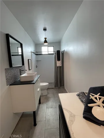 GALLERY - GARAGE MULTI-USE FLEX SPACE includes a three-quarter bath with full-sized laundry and utility sink. (Past picture)