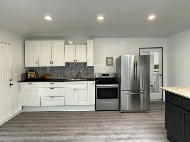 GALLERY - GARAGE MULTI-USE STUDIO, ENTERTAINING, GUEST SPACE with food preparation area. (Past picture, range is not present.)