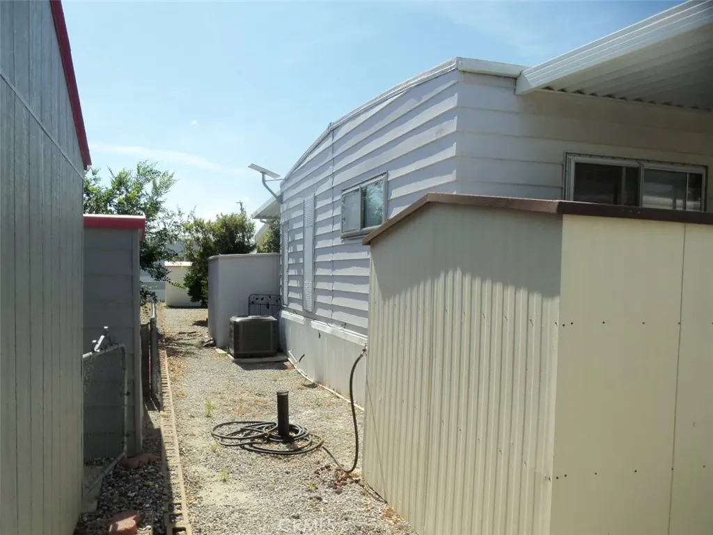 Rear of house showing 2 sheds and newer A/c