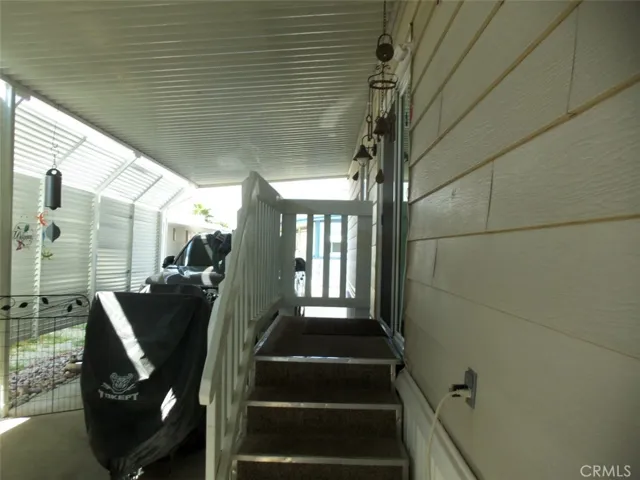 Carport entrance through dual glazed sliding glass door