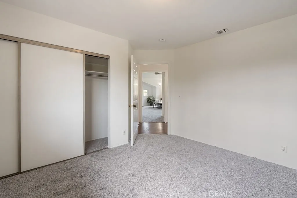 Bedroom #three is upstairs next to the primary bedroom and bath