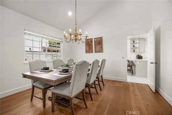The dining area is conveniently located between the formal living room and the kitchen.
