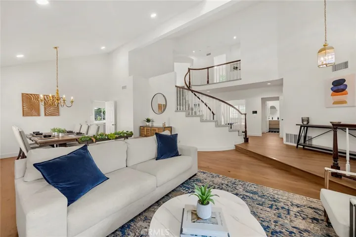 Notice the beautiful new plank flooring on the ground level. Not only does it look warm and inviting, it is also easy to maintain.