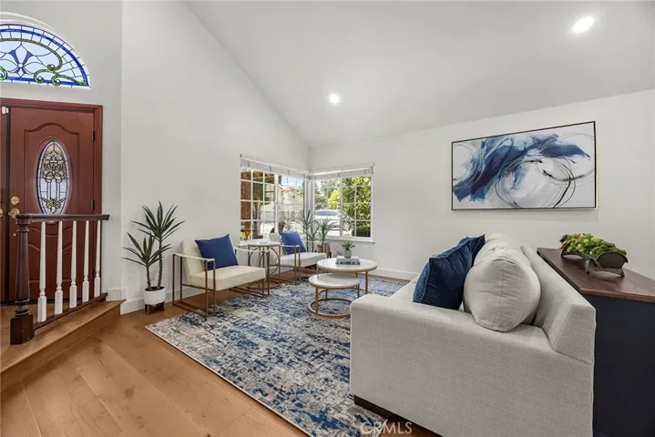 The living room will invite intimate chats, while still allowing for easy flow when entertaining. The living room flows to the dining area; the dining area flows to the kitchen; the kitchen flows to the backyard.