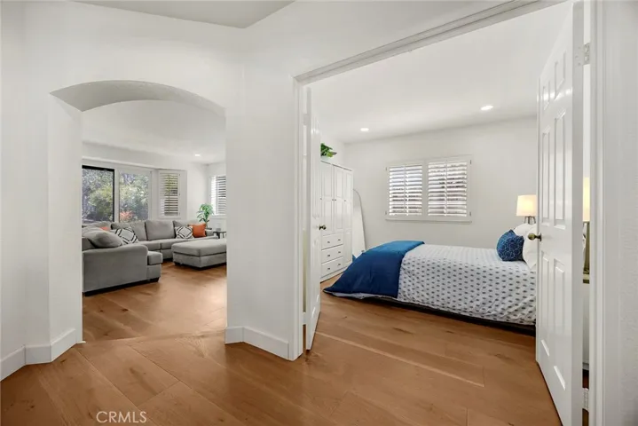 This view shows the ground level Bedroom #1, which could be used as an office. On the left is the casual family room with fireplace.