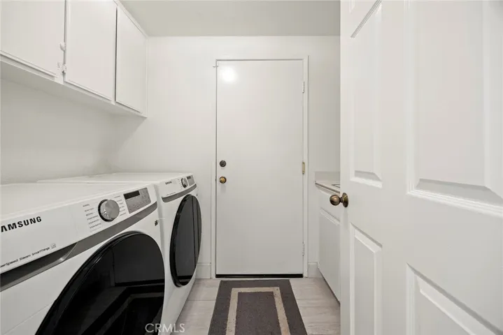 Getting laundry done feels less of a chore with this convenient location. The door in the center provides direct access from the home to the 3 car garage.