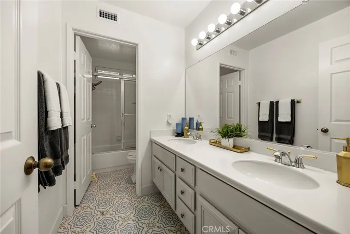 Full hall bath has been updated. It has a shower over tub combination with glass enclosure. Dual sink vanity makes getting ready for the day effortless. It is located upstairs between Bedroom #3 and Bedroom #4.