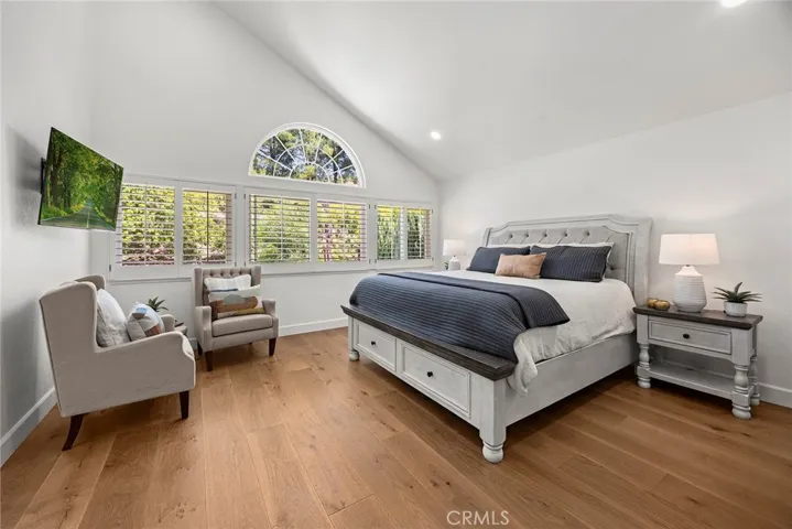 The primary bedroom is your sanctuary. Now more than ever, your home is a haven. It is where you are restored to greet each new day. A wall of windows brings in serene tree top views.