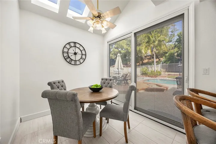 If you are obsessed with natural light, this home is for you! Multiple windows and sliding glass doors throughout provide light and outdoow views. This breakfast nook in the kitchen opens to the backyard.