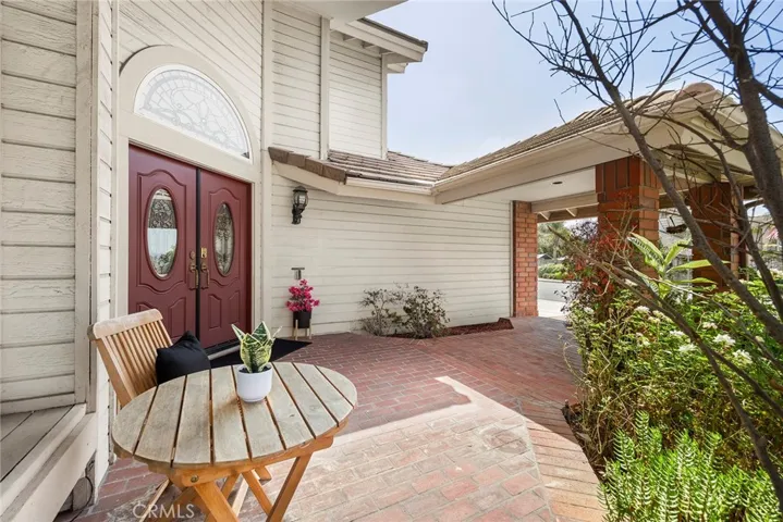 Gracious front porch is a lovely place to greet your guests.