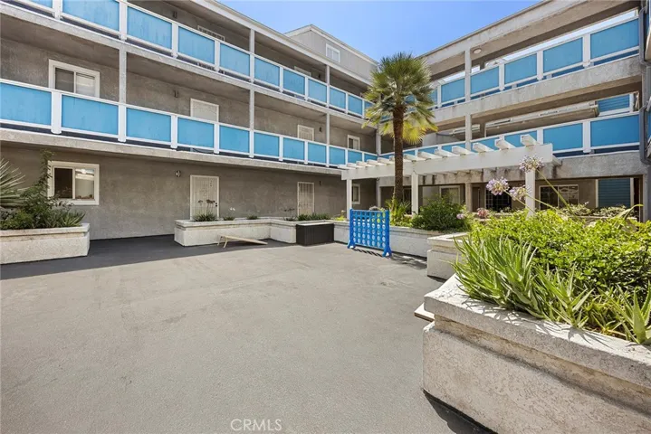 Beautifully maintained interior courtyard with inviting open-air gathering spaces and landscaped common areas.
