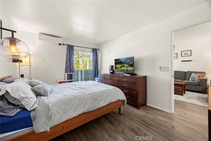 View of primary bedroom and entrance to living room.