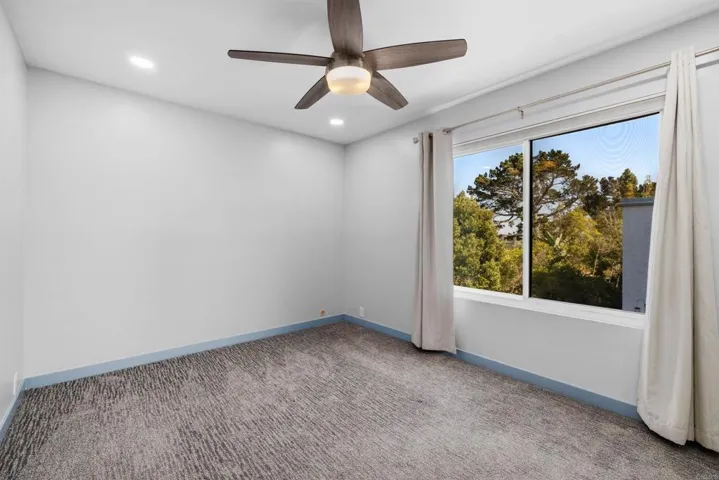 Rear Bedroom with Views of Lush Landscaping
