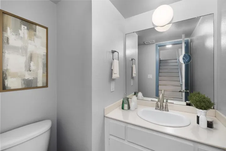 Virtually staged 1/2 bath close to Kitchen DR  LR