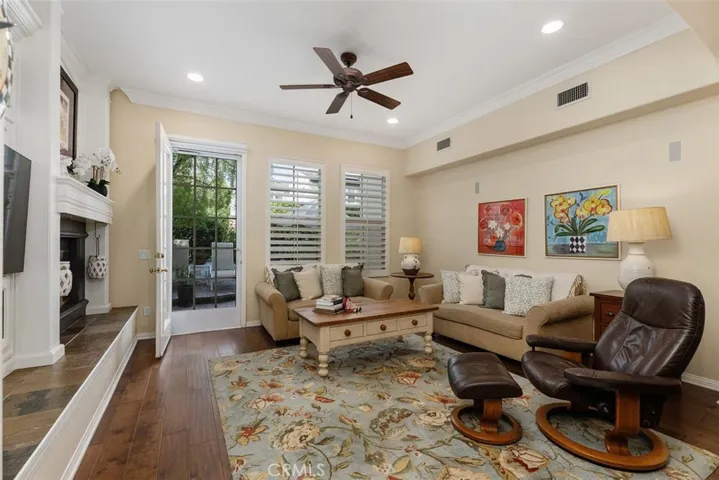 Spacious Family Room with Custom Media Niche and Inviting Fireplace.