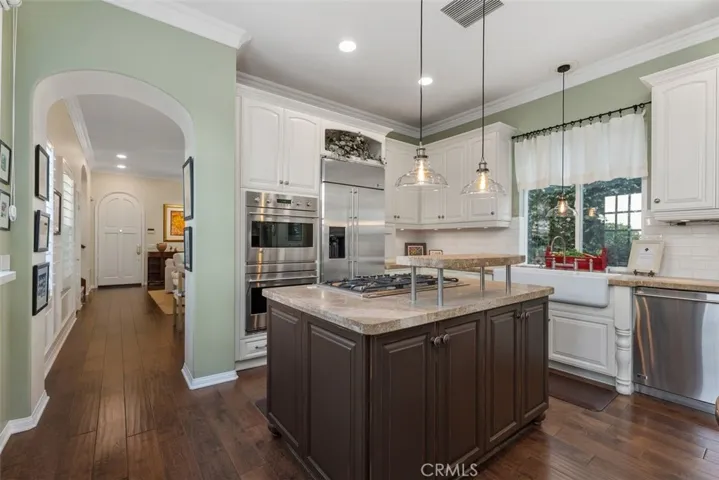 Exquisite Chef's Kitchen with High-end Appliances, Stone Counters and a Beautiful Farmhouse Sink.