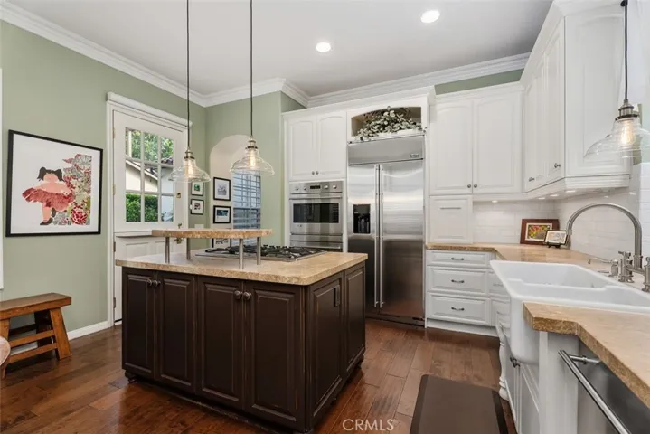 Exquisite Chef's Kitchen with High-end Appliances, Stone Counters and a Beautiful Farmhouse Sink.