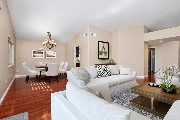 Living room and dining room digitally altered with virtual staging