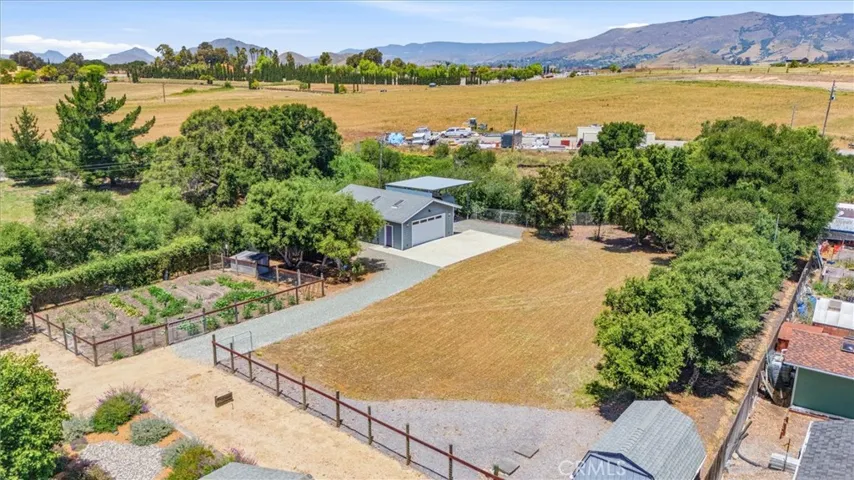 Fenced garden in the background.