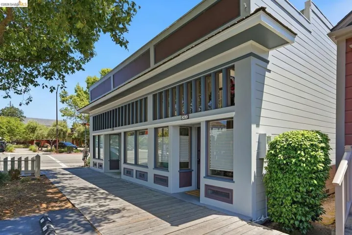 Commercial storefront featuring a boardwalk-style entrance and prominent display windows