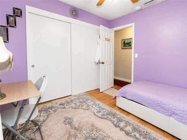 Cozy bedroom with closet storage and flexible space for a desk or vanity.