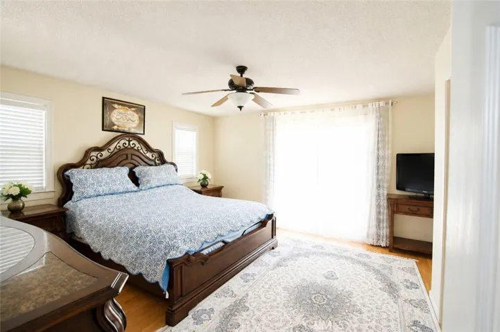 Comfortable bedroom with natural light and generous closet space.