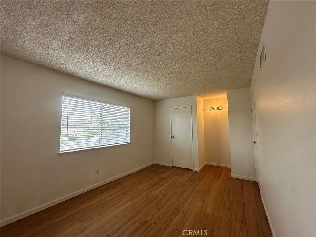 Primary Bedroom with a walk in closet