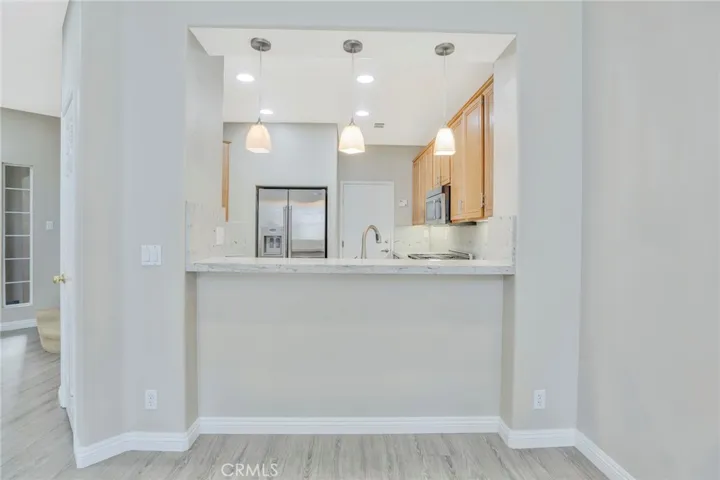 Dining area to kitchen with sit down bar