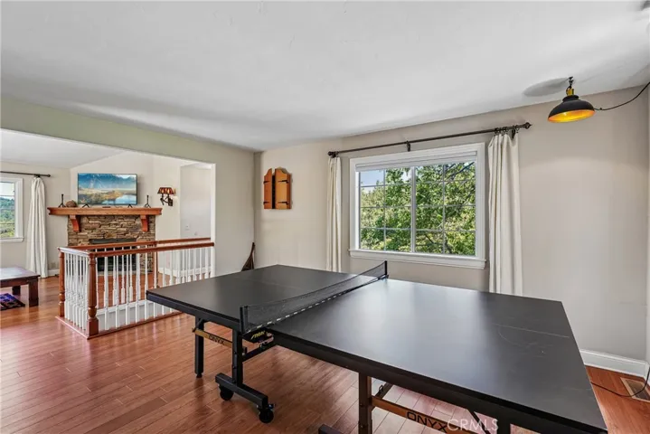 Flexible upper-level bonus area with space for games, hobbies, media, or overflow living, connected to the main living room for easy everyday use.