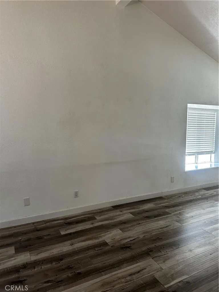 Come up the stairs to a large living room with vaulted ceilings