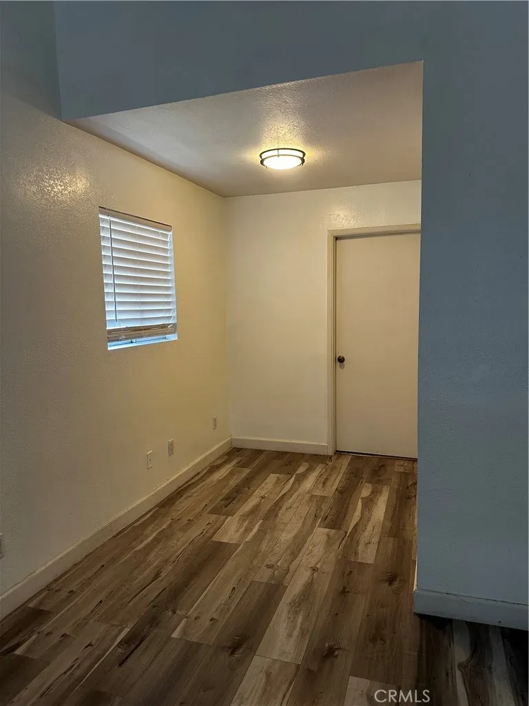 Area in bedroom that is a great space for a desk or exercise equipment