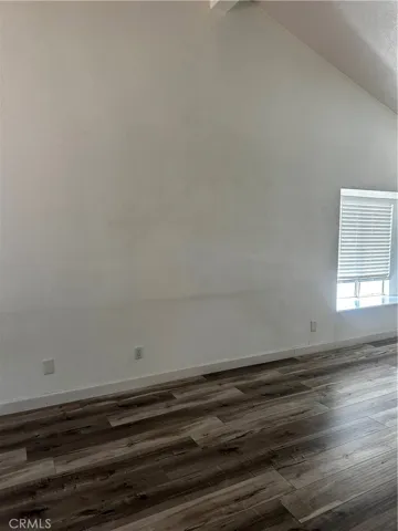 Come up the stairs to a large living room with vaulted ceilings