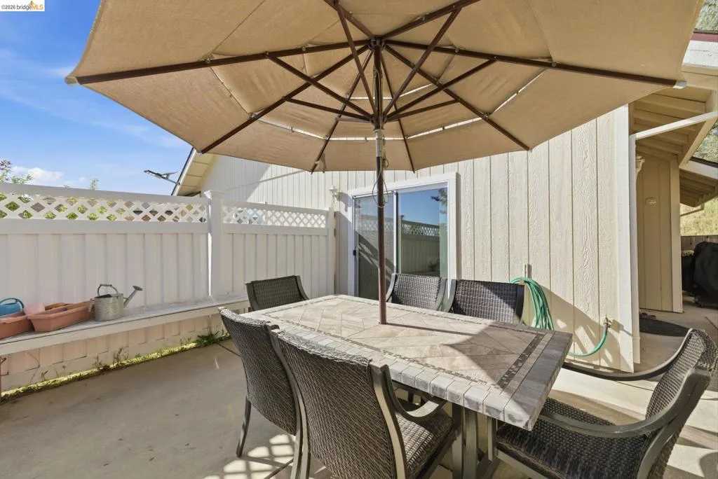 View of patio / terrace with outdoor dining area and a grill