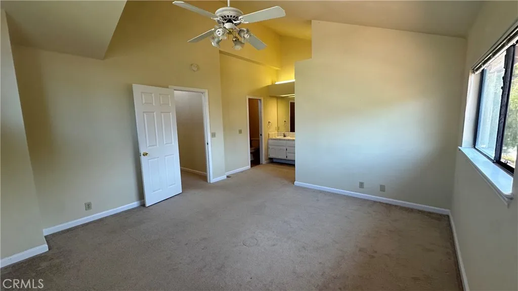 Large Primary Bedroom with ceiling fan.