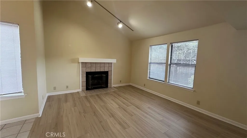 Living room: Look at those beautiful floors, just 6 months new, throughout all of the downstairs. Wood burning fireplace