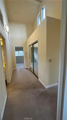 Upstairs hallway light and bright with closet.