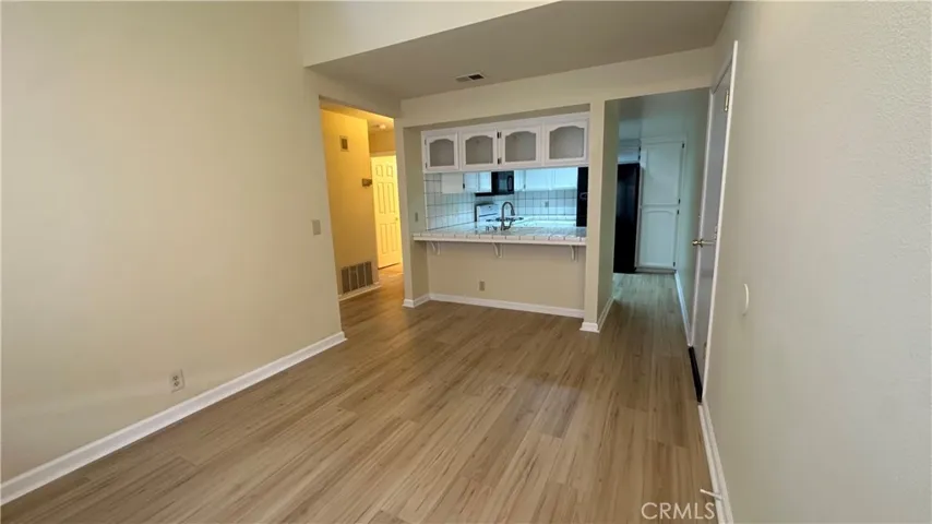 Beautiful dining area with vaulted ceilings, open to kitchen