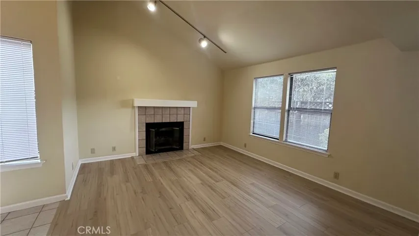 Living room: Look at those beautiful floors, just 6 months new, throughout all of the downstairs. Wood burning fireplace