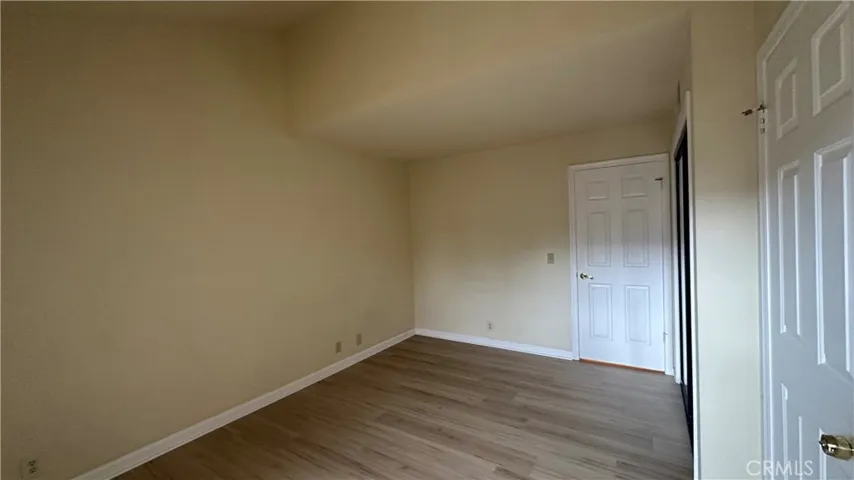 Downstairs 3rd bedroom with direct access to the backyard.