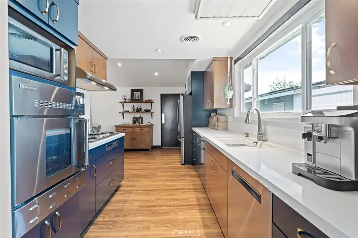 High end Stainless steel appliances including a Bluestar oven, Bosch dishwasher, GE Fridge