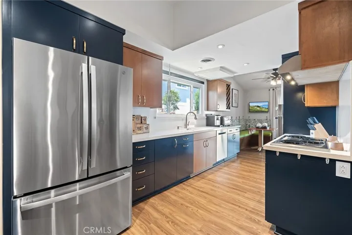 Remodeled kitchen with high quality wood cabinets.