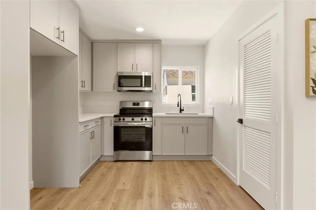 Unit A - Beautifully finishes, the kitchen combines custom cabinetry and modern finishes with functional everyday design.