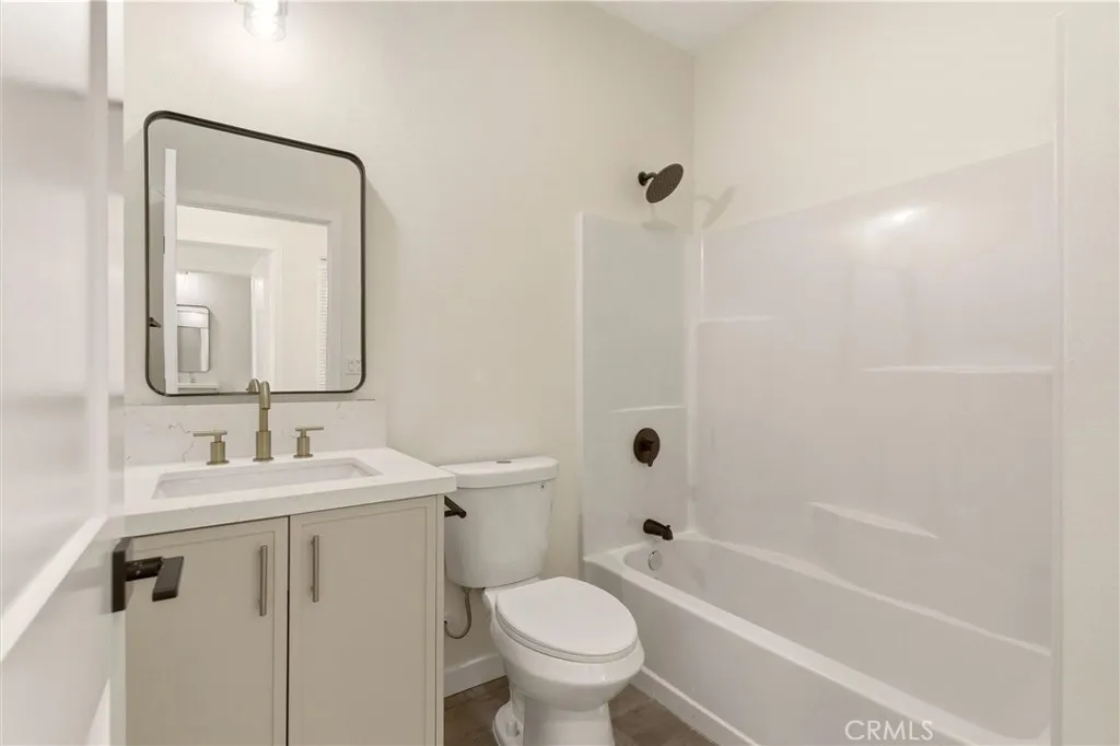 Unit B - The additional full bathroom is thoughtfully designed with new fixtures and modern finishes.